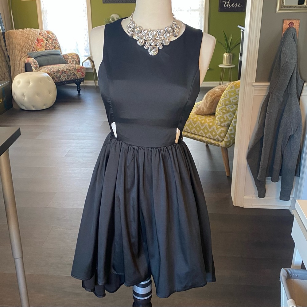 Francesca’s black sleeveless high low dress small